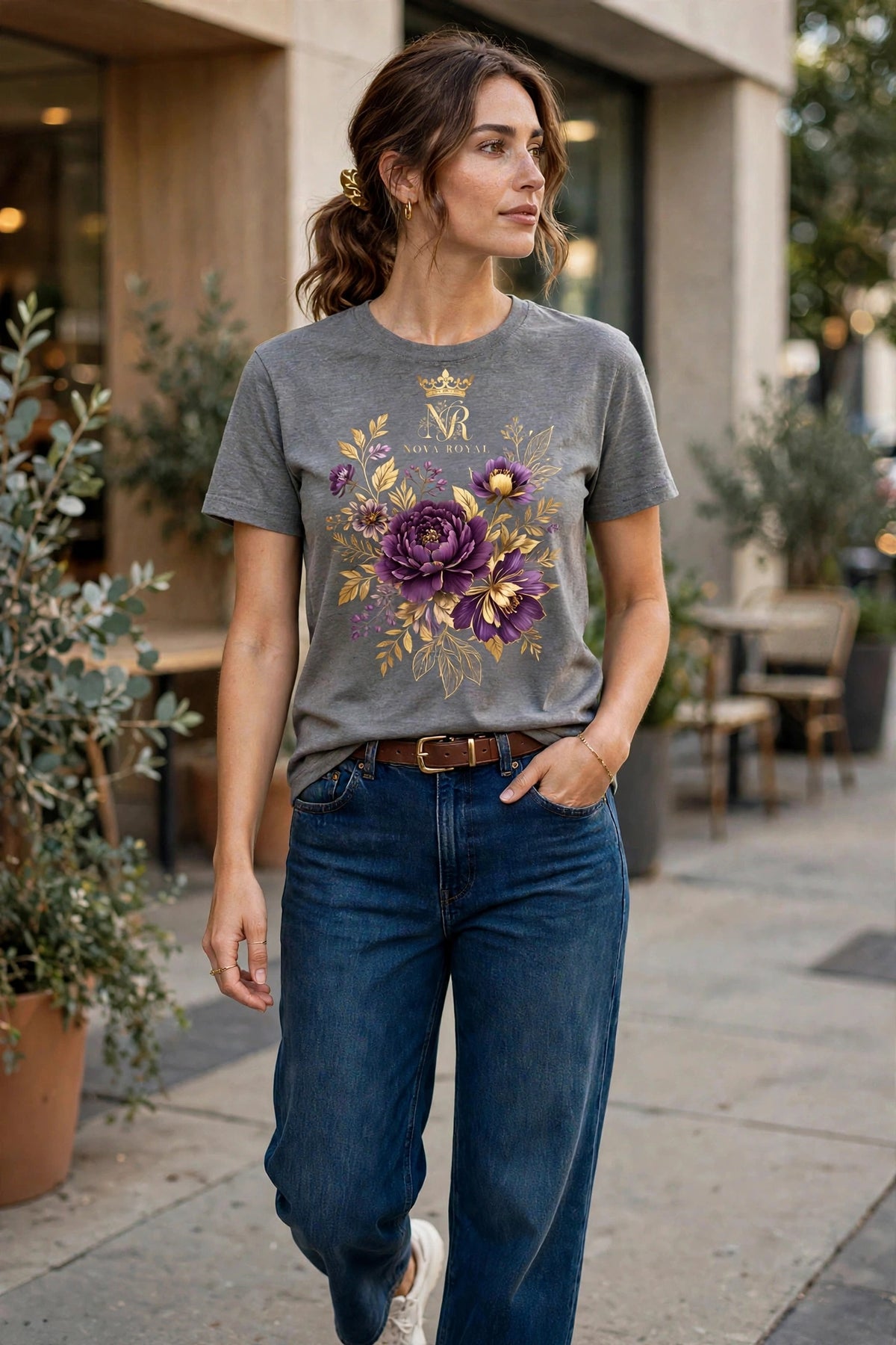 Woman wearing Grey Nova Bloom Royale Floral T-Shirt with gold NB logo on top